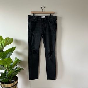 Topman distressed skinny jeans in washed black with knee rips